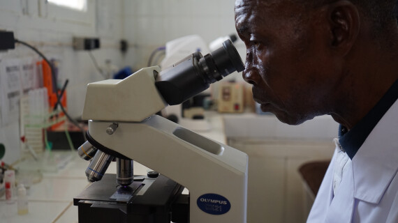 Paulin Madingi analyses a sample of a sleeping sickness patient